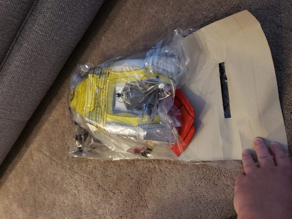 VOLTRON FORCE Costume - Package outer bag opened, cardboard insert unfolded